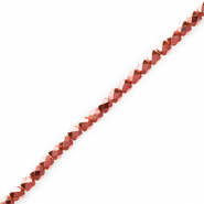 Perline sfaccettate rosso corallo metallico