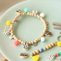 Scopri qui come creare i migliori bijoux con conchiglie ciprea e ciondoli pon pon