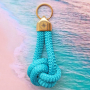 Idea con portachiavi Mix & Match con pelle DQ e cordoncino tubolare intrecciato